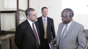 Provost Hyman and vice chancellor Kayanja talk after Hyman's lecture, as Bangsberg looks on.