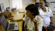 As part of a research project at McCord, led by instructor in medicine Ingrid Bassett, project manager Senica Chetty (left) and research assistant Nompumelelo Matilda Mazibuko (right) are matching HIV patients with "health system navigators" to help guide them through the multiple steps involved in treatment. 