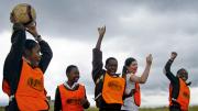 After the relay race, the winning team celebrates.
