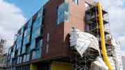 Two views of the Kyu Sung Woo-designed graduate-student housing now rising on Memorial Drive.