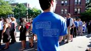 Peer advising fellows in blue tees and members of the Crimson Key Society in red tees cheered on the first-years entering Tercentenary Theatre.
