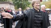 Drew Gilpin Faust, in the presidents division, enters Tercentenary Theatre for her installation. She is followed by former presidents Lawrence H. Summers, Neil L. Rudenstine (obscured), and Derek Bok; behind them is James Rothenberg, University Treasurer.
