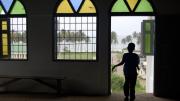 A child runs through the Anglican Church in Cape Coast, Ghana