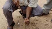 Launching an impromptu archaeological dig, Yaw Bredwa-Mensah, an archaeologist who co-teaches the Harvard Summer School course, extracts what turns out to be a German mineral-water bottle from a 17th-century street in Accra.