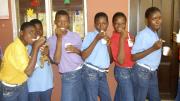 The girls take a break from activities for a snack. For some, this was the first time they ever tasted ice cream.
