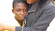 The end of the camp week was emotional for the girls, and for Johnson (shown here with camp participant Adewale Oluwadunni). The intensity of the experience makes it all the more important that Project Unveil have a continuing presence in the girls' lives, through the term-time after-school program and through camps held in future summers, says Johnson. 
