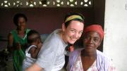 Ryan with Wozee, a neighbor in Dunkura with whom she regularly sold rice in the village schoolyard as part of her fieldwork. Her host mother, Abena Comfort Frema, appears in the background; on Ryan’s back is Frema’s granddaughter, Maame Yaa.