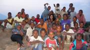 The SIC model relies on volunteers’ willingness to integrate themselves into the villages where they live (and seeks volunteers who will do so). In the late afternoon, Jasrasaria says, “the schoolchildren would climb up to the top of this <em>mwamba</em> (large rock) and we’d look out over the village and sing songs together.”