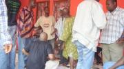 Discussing the water project in 2008 at a community-wide meeting with the Saahene (chief warrior of the village), village elders, a youth representative from the village, district government officials, and a local nongovernmental organization (NGO).