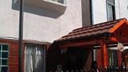 The units also had no-frills front yards in their original condition; the Huertas embellished their windows and added a fence, a bench, and an ornamental awning.