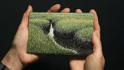 The artist holds <i>Summer Salt Marsh</i> (2008).