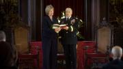 President Faust and General Casey share a hymnal while singing "America the Beautiful" near the close of the service.