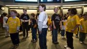 Another group of volunteers demonstrates phase changes: solid... 