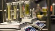 Immersing various types of fat in a warm water bath demonstrates the fats’ different melting points. At this temperature, olive oil is liquid, while butter, shortening, and cocoa butter are solid. 