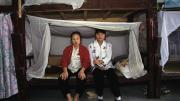 Factory girls in their dormitory, Guangdong Province