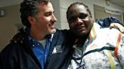 Gross with street worker Dimky Edouard at an informal session with gang members
