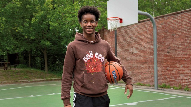 Ibrahim Barry with a basketball on a court