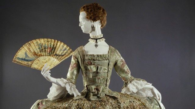 Ornate eighteenth-century dress with wide hooped skirt