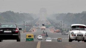 The <em>Rajpath,</em> or King’s Way, in New Delhi runs from the federal government complex to the India Gate monument (seen through morning fog in the distance). It is the route for the annual Republic Day parade.