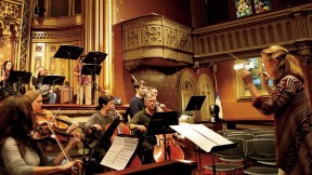 Sara Jobin conducts a rehearsal of <i>Purchase of Manhattan,</i> which premiered at the Marble Collegiate Church in November.