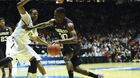 All-Ivy forward Kyle Casey ’13 drives toward the hoop against Vanderbilt’s Rod Odom.