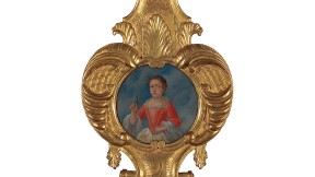 portrait of young girl surrounded by ornate gold-painted frame