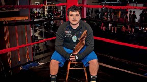Victor A. Lopez sits in a boxing ring