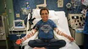 All in a day’s treatment: Khaled, seen in these photographs with hemapheresis practitioner Beverly Gedutis, R.N., and author David Nathan, spent May 8 at Children’s Hospital Boston, where for decades he has been transfused with red blood cells every three weeks. The bottles he carries below contain the iron chelator deferisirox.