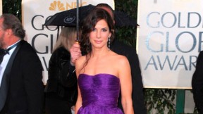 Sandra Bullock arrives at the 2010 Golden Globe Awards in a violet Bottega Veneta gown.