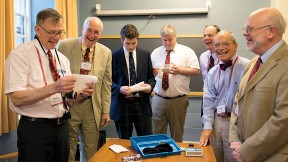 From left: David Otto, Bruce Johnson, Xandy Walsh, Alex Walsh, John Fryer, Tony Rossmann, and Paul Bamberg read letters buried in 1988. 