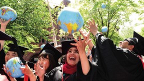 Kennedy School mid-career-degree celebrants (from left) Tadahiro Ikemoto, M.P.H. &rsquo;14, M.P.A. &rsquo;15, of Japan, Zhuldyz Bakytzhanova, M.P.A. &rsquo;15, Sahar Albazar, M.P.A. &rsquo;15, of Egypt, and Alvaro Henzler, M.P.A. &rsquo;15, of Peru