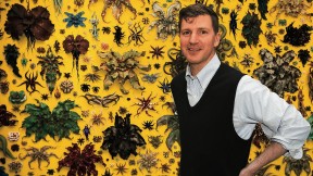 Adams in front of his 2015 installation, <i>Life, or Something Like It.</i>