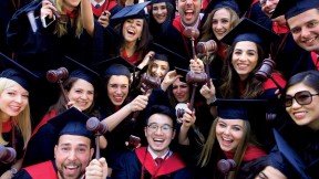 Law School graduates flaunt their profession’s symbol of authority.