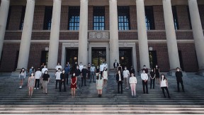 Group of degree candidates from the Design School pose on the steps of Widener for an unofficial Class Day photo.