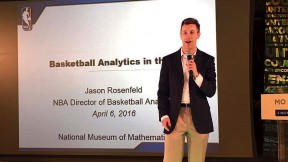 Jason Rosenfeld delivers a presentation with microphone in hand