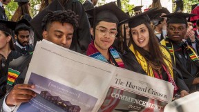 Graduates-to-be read the student newspaper, absent a University Gazette