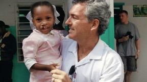 Brian Mullaney with a Haitian patient before her surgery this past February. Smile Train has provided roughly 160 surgeries in Haiti and recently launched “Cleft-free Haiti” to completely eradicate cleft there.