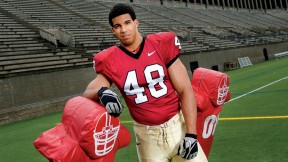 Defensive tackle Josue Ortiz with a blocking sled at Harvard Stadium