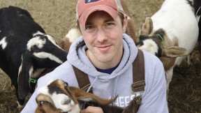 Max Sandvoss with some of his goats at the First Light Farm and Creamery in East Bethany, New York 