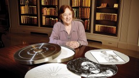 Porter University Professor Helen Vendler in Houghton Library with a copy of the Arion Press edition of John Ashbery's "Self-Portrait in a Convex Mirror"