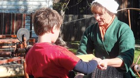 Traditional artisans, such as spinners, demonstrate their skills at Strawbery Banke.