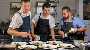 Chef/owner Alex Crabb shares the open kitchen with fellow cooks Tyson Wardwell and Nathan &ldquo;Lazer&rdquo; Phinisee.