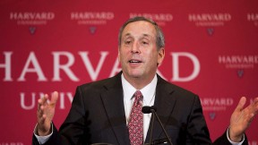 News photo of President-designate Bacow, with Harvard necktie, at his announcement news conference, February 11, 2018