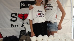 Rebecca Cooper (left) and Lily Erlinger at a Socks for America distribution event
