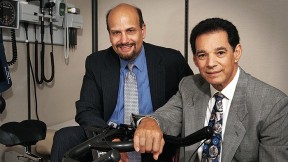 James Katz (left) and Bob Nadelberg with an indoor bicycle at their offices