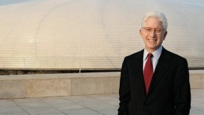 James Snyder stands in front of the exterior dome of the Israel Museum’s Shrine of the Book, which houses the Dead Sea Scrolls.