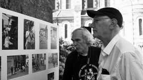 Peter Winship (left) and Bill Christian examine photographs recalling their days as student researchers in the village of Chanzeaux, under the tutelage of the late Laurence Wylie.
