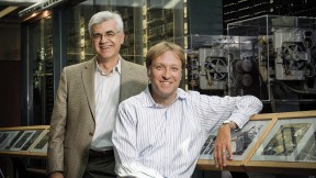 Efthimios Kaxiras (left) and Hanspeter Pfister in front of a portion of Howard Aiken&rsquo;s Mark I computing machine 