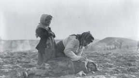 The endless pain of the Middle East: woman and dead child near Aleppo, Syria (undated)