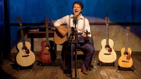 Benjamin Scheuer playing one of the six instruments he uses in the course of his one-man musical, The Lion